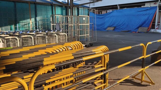 Yellow Metal Crowd Control Barriers Stacked Outdoor Urban Storage after event ends