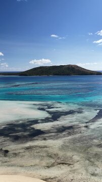 Vertical drone view of a coral reef and island, Oarsmans Bay, Fiji