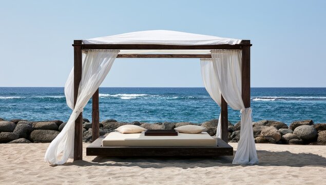 Outdoor canopy bed setup for relaxation on a sunny beach by the ocean