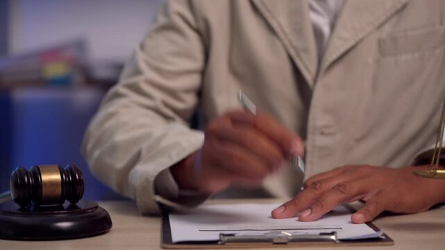 Lawyer Carefully Reviewing Contract Before Signing Legal Agreement