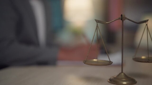 Scales of Justice on Office Desk Symbolizing Legal Balance and Fair Judgment