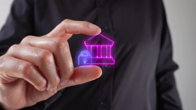 Close-up of a woman's hands holding a virtual bank and padlock icon between her two fingers. Ideal for digital banking or financial technology security.