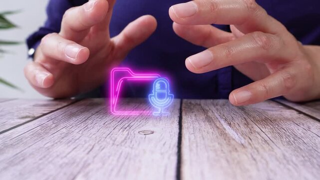 Hands hover over a virtual digital folder icon with a microphone.
