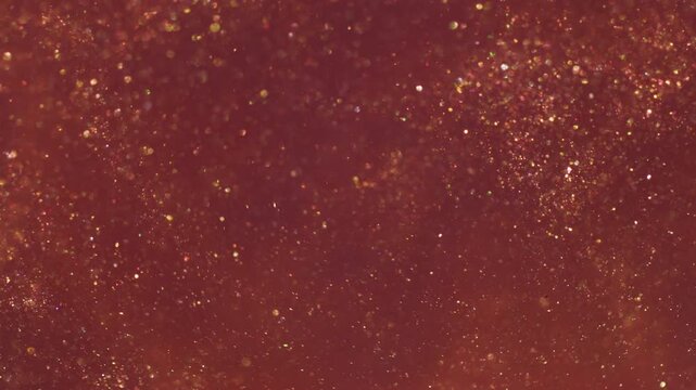 Bokeh leak twirl. Flare glimmer. Red orange yellow mixing light flow. Shimmering color particles spill abstract art reflection background.