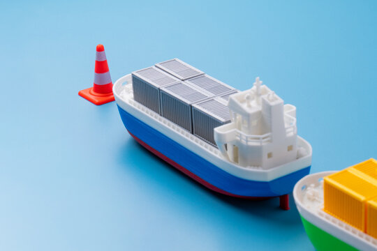 Supply chain disruption, maritime trade blockages, port congestion, shipping delays, global logistics conflict concept.