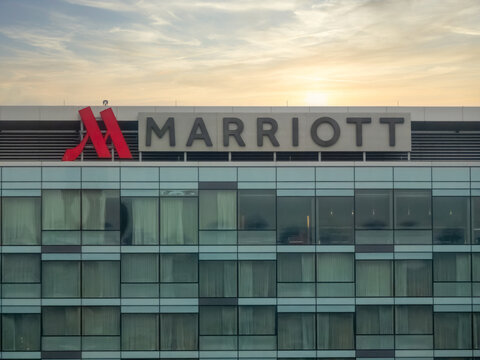 Calgary, Alberta, Canada. July 14, 2026. Exterior of the Calgary Airport Marriott In-Terminal Hotel facade under late afternoon light.