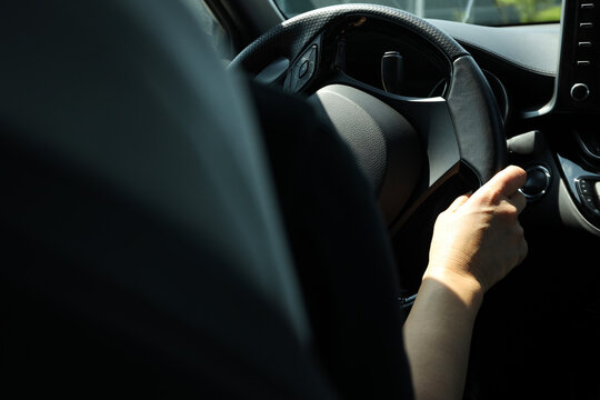 Driver grips steering wheel while approaching gas station