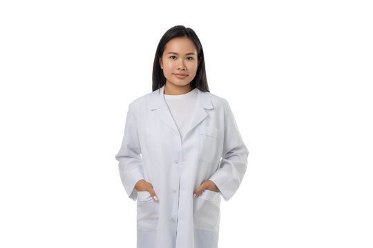 Doctor in lab coat, hands in pockets, isolated on white, PNG