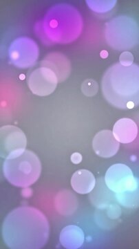 Abstract vertical background with purple and pink bokeh lights on soft gray gradient for mobile wallpapers and festive digital backdrops
