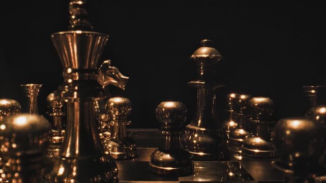 chess, pieces, board, gold, silver, metal, luxury, strategy, game, soft, dramatic, dark background, indoor, moody, cinematic, atmospheric, competition, intelligence, elegant, premium, still life, obje