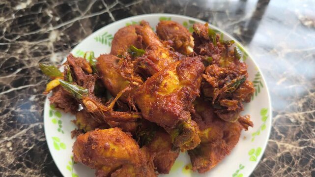 Crispy fried chicken pieces coated in rich aromatic spices. The meat was marinated overnight to allow deep plant-based flavors to infuse. It looks delicious and ready to serve.