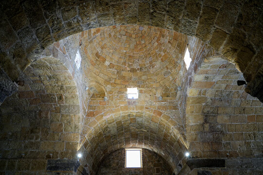 Ancient stone dome and barrel vaults inside the Basilica of Saint Antiochus (Basilica di Sant'Antioco Martire) in Sardinia, Italy