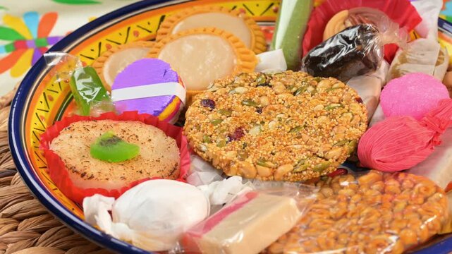 Authentic Mexican handcraft candy mix on a woven placemat