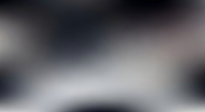 Abstract blurred dark grey and white background with soft light and shadows moody atmospheric texture