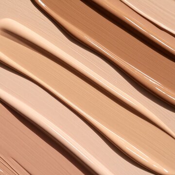 Liquid beauty foundation swatches in diverse skin tones showing smooth cosmetic texture