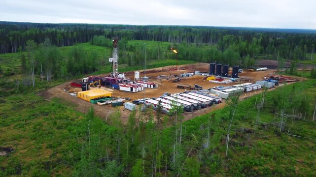 Aerial view of a remote Alberta drilling site with H₂S flares