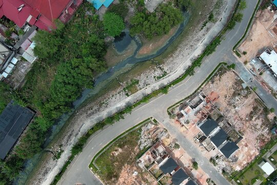 Aerial Top-Down View of a New Residential Development Next to an Urban Drainage Canal