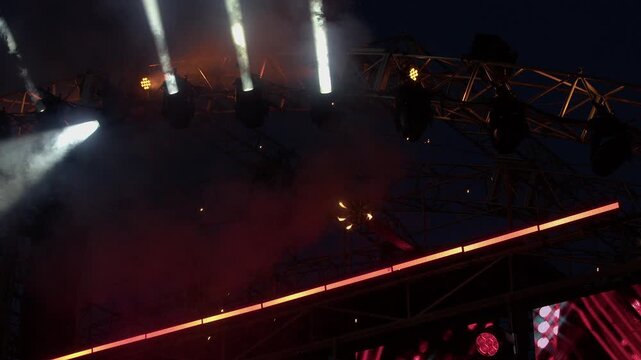 Pyrotechnic display: Sparks fly from rotating disc on outdoor stage