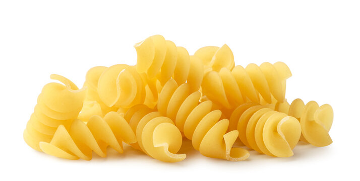 Pile of spiral pasta close-up on a white background. Isolated