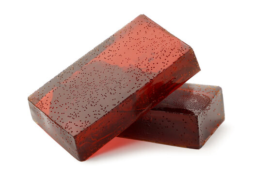 Red jelly cube on a white background. Isolated