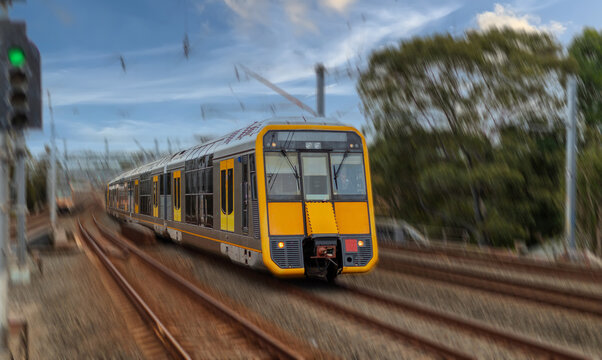 Passenger Train going through Lewisham Train Station at Sunset a suburban Sydney train Station in Sydney NSW Australia