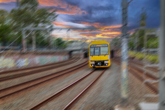 Passenger Train going through Lewisham Train Station at Sunset a suburban Sydney train Station in Sydney NSW Australia