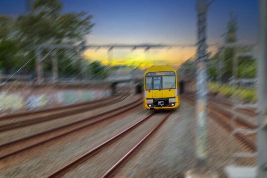 Passenger Train going through Lewisham Train Station at Sunset a suburban Sydney train Station in Sydney NSW Australia