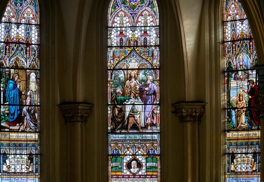 Three colored stained glass from the church, left is Healing sich person, in the middle is Last Supper, right Baptism of Jesus, down is Franz Joseph
