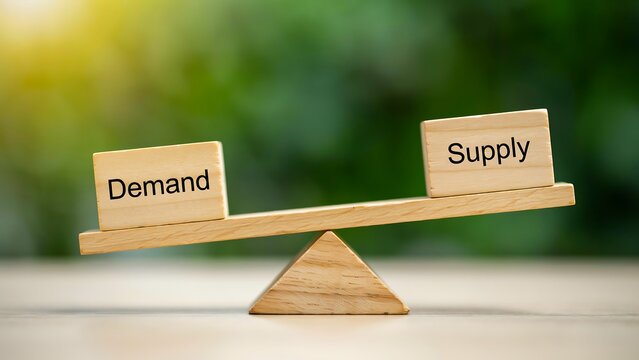 Demand and supply balance concept with wooden blocks on seesaw