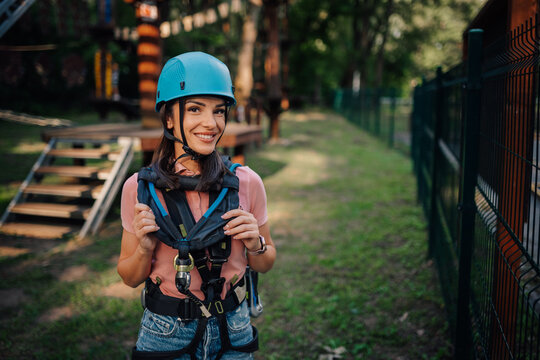 Woman preparing for adventure park challenge