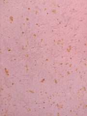 Fototapeta premium pink paper texture rusty grunge texture with scratches and worn marks. Orange-red and pink hues, distressed industrial surface. Isolated background