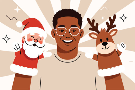 Smiling man holding a Santa Claus and a reindeer hand puppet, celebrating the holiday season with a cheerful, festive attitude.