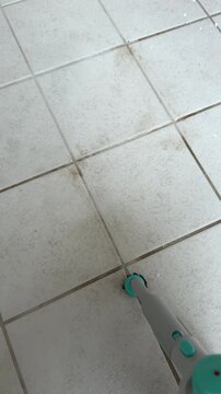 Steam Cleaning Kitchen Floor Tiles and Grout for Deep Hygienic Cleaning
