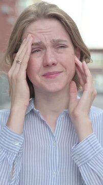 Portrait of Woman having Headache, Outdoor, Vertical Video