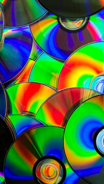 Reflection of the surface of a DVD discs with artistic lighting close-up