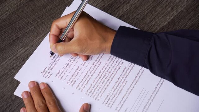 Close Up of Completing Last Will and Testament