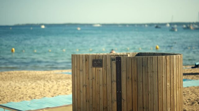 Beach changing booth offering privacy for swimmers. Perfect for summer vacations, holidays, and coastal leisure