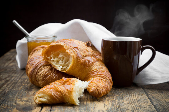 Croissants, fig jam and cup of hot coffee