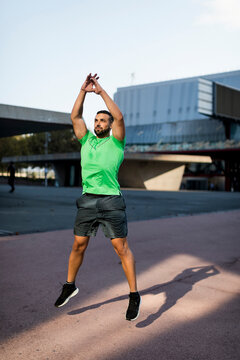 Sportive man during workout, jumping jack
