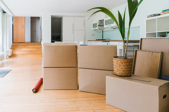 Cardboard boxes in an empty modern apartment during relocation