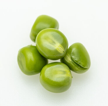 Fresh green peas on a clean white background