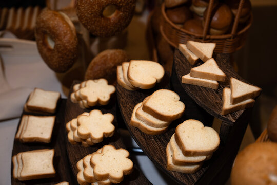 Freshly baked bread with golden crust and soft interior, resting on a rustic surface, evoking warmth, homemade baking tradition, and comforting bakery aroma.