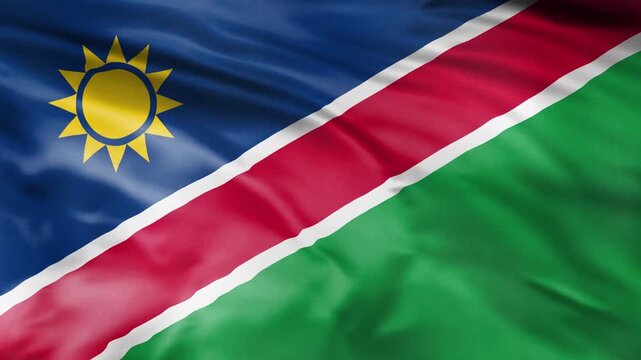 Namibian flag waving in wind creating cinematic motion video footage.