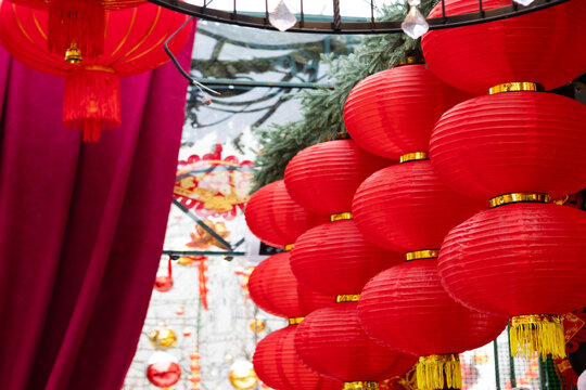 Traditional Chinese New Year decorations made of red lanterns. Chinese New Year. Big red paper lanterns on the street. Chinese New Year celebration. Background for the design.