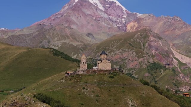 Gergeti trinity church near mount kazbek in georgia aerial view.