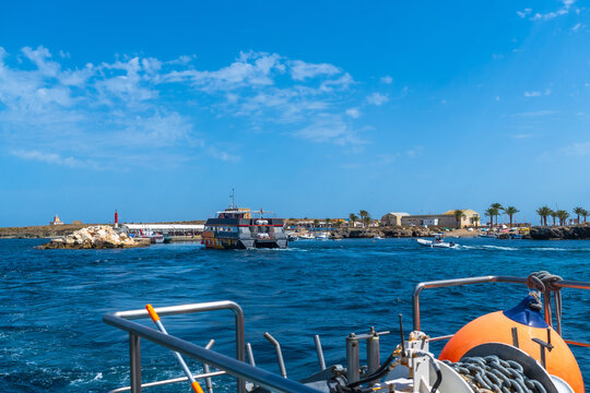 Departing tabarca island port, summer travel vacation
