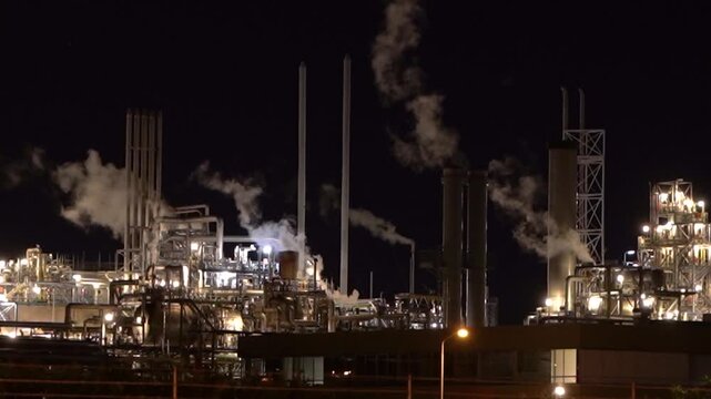 HVC Waste-to-Energy Plant in Dordrecht, Netherlands, Operating at Night with Emissions Visible from Chimneys.