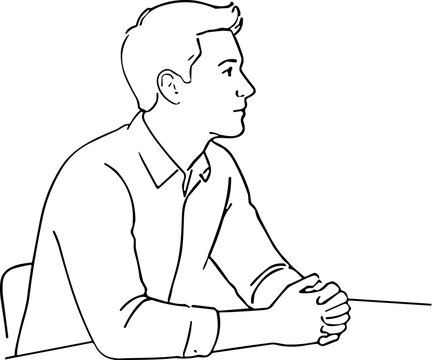 Man in profile sitting at a table with hands clasped
