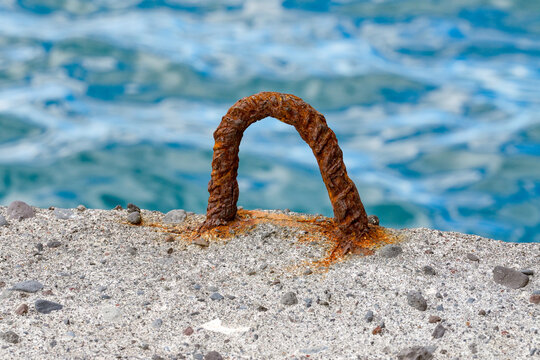 Old, rusting bollard at the harbor