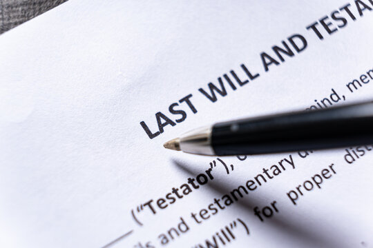 Close Up of Pen Pointing to Last Will and Testament Document